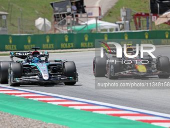 George Russell, from Mercedes-AMG PETRONAS Formula One Team, is driving a Mercedes W15, and Sergio Perez, from Oracle Red Bull Racing team,...