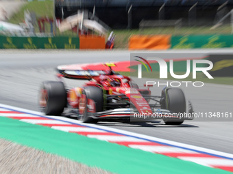 Carlos Sainz, from Scuderia Ferrari HP, is driving a Ferrari SF24 during practice 1 of the Formula 1 Aramco Spanish Grand Prix, held at the...