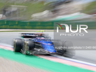 Logan Sargeant is driving a Williams FW46 from Williams Racing during practice 1 of the Formula 1 Aramco Spanish Grand Prix, held at the Bar...