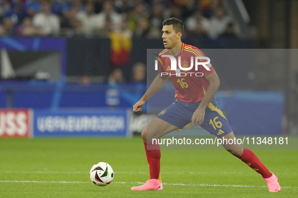 Rodrigo Hernandez defensive midfield of Spain and Manchester City during the UEFA EURO 2024 group stage match between Spain and Italy at Are...