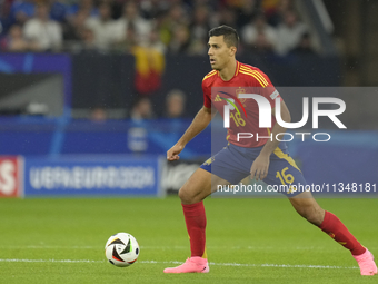 Rodrigo Hernandez defensive midfield of Spain and Manchester City during the UEFA EURO 2024 group stage match between Spain and Italy at Are...