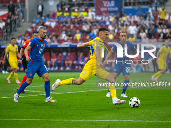 Oleksandr Tymchyk of Ukraine is shooting  during the UEFA EURO 2024 group stage match between Slovakia and Ukraine at Dusseldorf Arena on Ju...