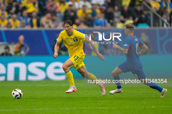 Ilya Zabarnyi of Ukraine is shooting  during the UEFA EURO 2024 group stage match between Slovakia and Ukraine at Dusseldorf Arena on June 2...