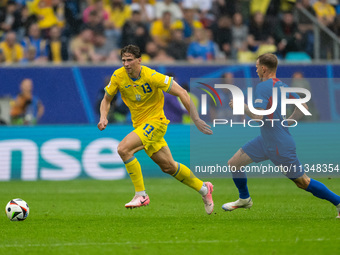 Ilya Zabarnyi of Ukraine is shooting  during the UEFA EURO 2024 group stage match between Slovakia and Ukraine at Dusseldorf Arena on June 2...