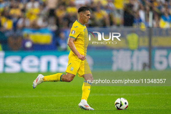 Oleksandr Tymchyk of Ukraine is controlling the ball  during the UEFA EURO 2024 group stage match between Slovakia and Ukraine at Dusseldorf...