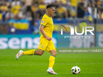 Oleksandr Tymchyk of Ukraine is controlling the ball  during the UEFA EURO 2024 group stage match between Slovakia and Ukraine at Dusseldorf...