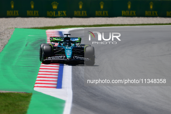 Fernando Alonso of Aston Martin Cognizant F1 Team is driving his single-seater during free practice of the Spanish GP, the 10th round of the...