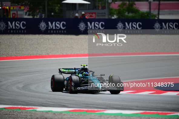 Fernando Alonso of Aston Martin Cognizant F1 Team is driving his single-seater during free practice of the Spanish GP, the 10th round of the...