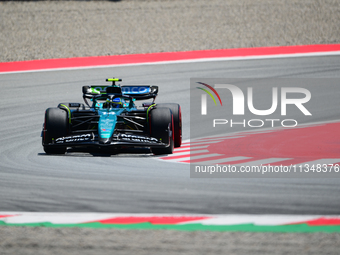 Fernando Alonso of Aston Martin Cognizant F1 Team is driving his single-seater during free practice of the Spanish GP, the 10th round of the...