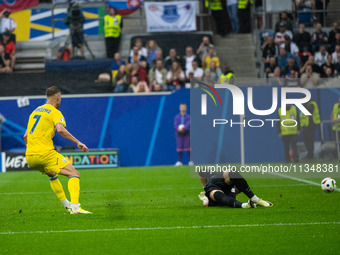 Andriy Yarmolenko of Ukraine is playing against Martin Dubravka of Slovakia  during the UEFA EURO 2024 group stage match between Slovakia an...