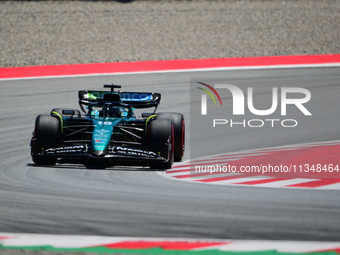 Lance Stroll of Aston Martin Cognizant F1 Team is driving his single-seater during free practice of the Spanish GP, the 10th round of the Fo...