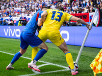 Robert Bozenik of Slovakia is confronting Ilya Zabarnyi of Ukraine (L-R)  during the UEFA EURO 2024 group stage match between Slovakia and U...