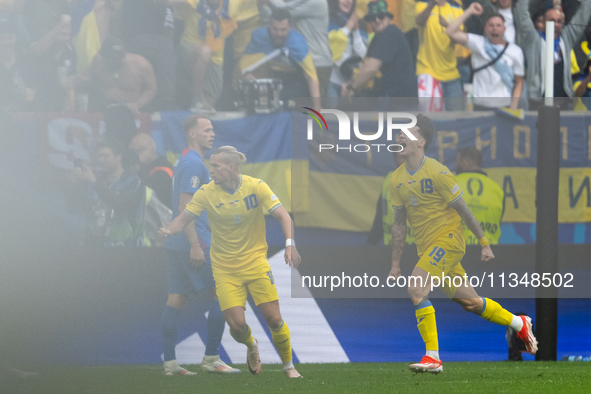 Mykola Shaparenko (R) of Ukraine is celebrating after scoring his team's first goal with Mykhailo Mudryk (L) of Ukraine  during the UEFA EUR...