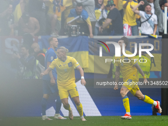 Mykola Shaparenko (R) of Ukraine is celebrating after scoring his team's first goal with Mykhailo Mudryk (L) of Ukraine  during the UEFA EUR...