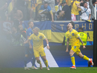 Mykola Shaparenko (R) of Ukraine is celebrating after scoring his team's first goal with Mykhailo Mudryk (L) of Ukraine  during the UEFA EUR...