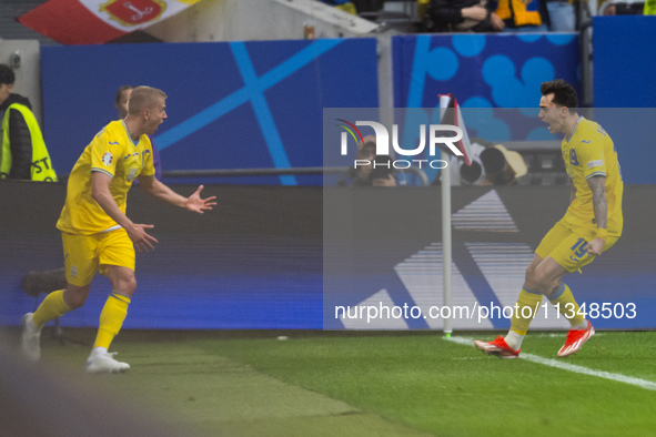 Mykola Shaparenko (R) of Ukraine is celebrating after scoring his team's first goal with Oleksandr Zinchenko (L) of Ukraine  during the UEFA...