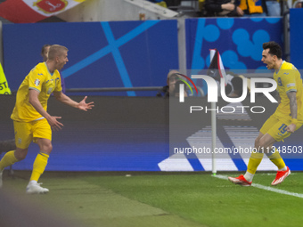 Mykola Shaparenko (R) of Ukraine is celebrating after scoring his team's first goal with Oleksandr Zinchenko (L) of Ukraine  during the UEFA...