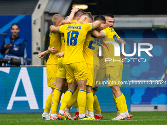 Roman Yaremchuk of Ukraine is celebrating after scoring his team's second goal with his teammates  during the UEFA EURO 2024 group stage mat...