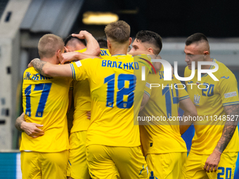 Roman Yaremchuk of Ukraine is celebrating after scoring his team's second goal with his teammates  during the UEFA EURO 2024 group stage mat...