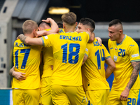 Roman Yaremchuk of Ukraine is celebrating after scoring his team's second goal with his teammates  during the UEFA EURO 2024 group stage mat...