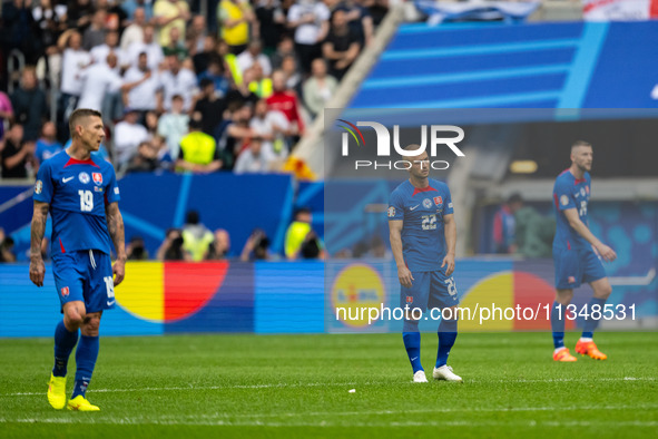 Juraj Kucka and Stanislav Lobotka (L-R) of Slovakia are looking dejected after Ukraine's second goal  during the UEFA EURO 2024 group stage...