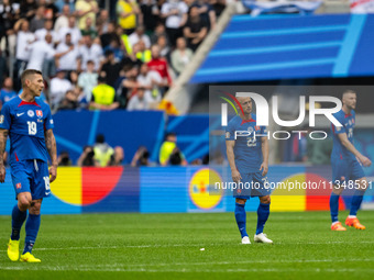 Juraj Kucka and Stanislav Lobotka (L-R) of Slovakia are looking dejected after Ukraine's second goal  during the UEFA EURO 2024 group stage...