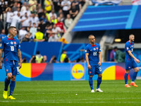 Juraj Kucka and Stanislav Lobotka (L-R) of Slovakia are looking dejected after Ukraine's second goal  during the UEFA EURO 2024 group stage...