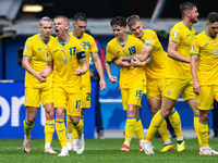 Roman Yaremchuk of Ukraine is celebrating after scoring his team's second goal with his teammates  during the UEFA EURO 2024 group stage mat...