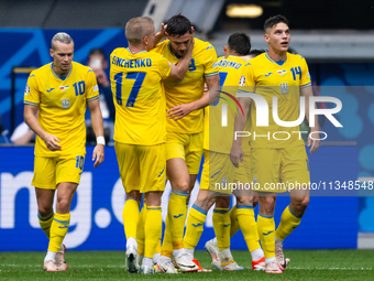 Roman Yaremchuk of Ukraine is celebrating after scoring his team's second goal with Oleksandr Zinchenko of Ukraine  during the UEFA EURO 202...