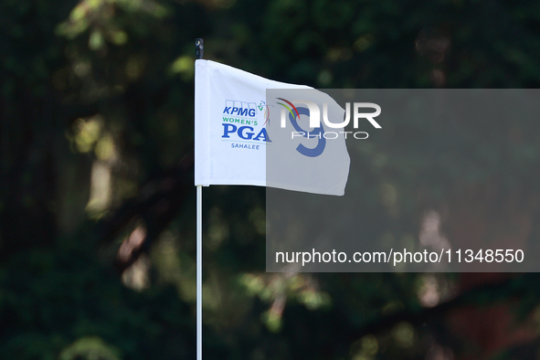 The flag at the 9th hole floats in the breeze during the first round of the KPMG Women's PGA Championship at Sahalee Country Club on Thursda...