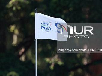 The flag at the 9th hole floats in the breeze during the first round of the KPMG Women's PGA Championship at Sahalee Country Club on Thursda...