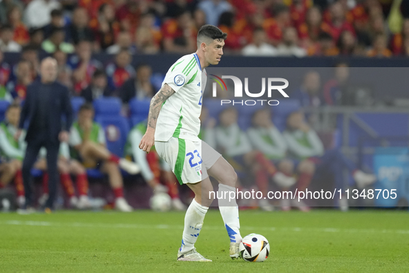 Alessandro Bastoni centre-back of Italy and Inter Milan does passed during the UEFA EURO 2024 group stage match between Spain and Italy at A...