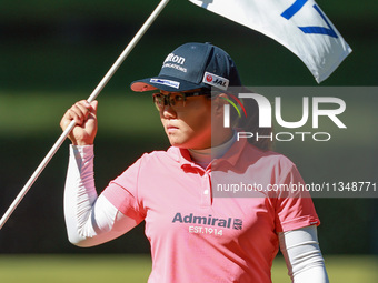 Nasa Hataoka of Japan holds the flag for the 17th hole during the first round of the KPMG Women's PGA Championship at Sahalee Country Club o...