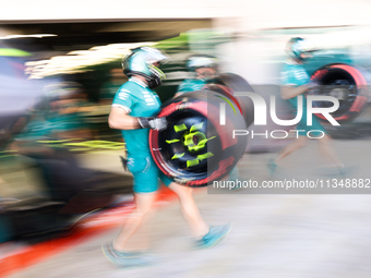 Aston Martin Aramco mechanics during second practice ahead of the Formula 1 Spanish Grand Prix at Circuit de Barcelona-Catalunya in Barcelon...