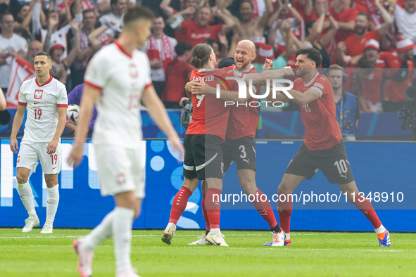 Marcel Sabitzer, Gernot Trauner, Florian Grillitsch are playing during the UEFA Euro 2024 Group D match between Poland v Austria, at the Oly...