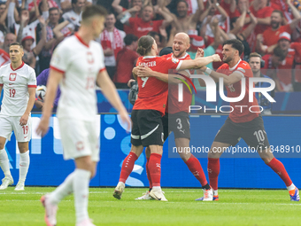 Marcel Sabitzer, Gernot Trauner, Florian Grillitsch are playing during the UEFA Euro 2024 Group D match between Poland v Austria, at the Oly...