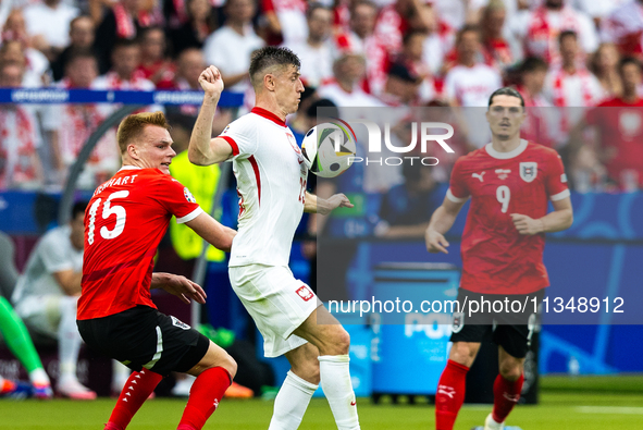 Stefan Posch, Krzysztof Piatek are playing during the UEFA Euro 2024 Group D match between Poland v Austria, at the Olympiastadion in Berlin...