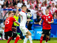 Stefan Posch, Krzysztof Piatek are playing during the UEFA Euro 2024 Group D match between Poland v Austria, at the Olympiastadion in Berlin...