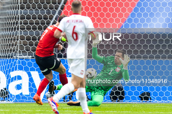 Marko Arnautovic, Wojciech Szczesny are playing during the UEFA Euro 2024 Group D match between Poland v Austria, at the Olympiastadion in B...