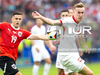 Christoph Baumgartner, Adam Buksa are playing during the UEFA Euro 2024 Group D match between Poland v Austria, at the Olympiastadion in Ber...