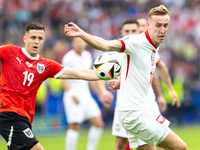 Christoph Baumgartner, Adam Buksa are playing during the UEFA Euro 2024 Group D match between Poland v Austria, at the Olympiastadion in Ber...