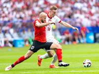 Gernot Trauner, Adam Buksa are playing during the UEFA Euro 2024 Group D match between Poland v Austria, at the Olympiastadion in Berlin,Ger...