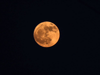 The full moon is rising over Deir al-Balah in the central Gaza Strip, on June 21, 2024, as the conflict is continuing in the Palestinian ter...