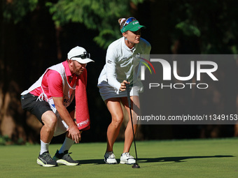 Lexi Thompson of the United States lines up her putt on the 11th green during Day Two of the KPMG Women's PGA Championship at Sahalee Countr...