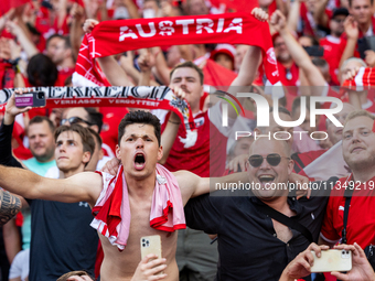 Austrian fans are celebrating victory   during the UEFA Euro 2024 Group D match between Poland v Austria, at the Olympiastadion in Berlin,Ge...