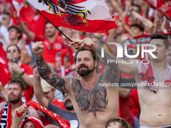 Austrian fans are celebrating victory   during the UEFA Euro 2024 Group D match between Poland v Austria, at the Olympiastadion in Berlin,Ge...