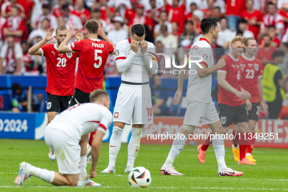 Konrad Laimer, Stefan Posch, Piotr Zielinski, Robert Lewandowski are playing during the UEFA Euro 2024 Group D match between Poland v Austri...