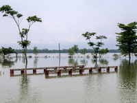 A partially submerged bridge is being seen after a flood in Gowainghat, Sylhet, Bangladesh, on June 21, 2024. (