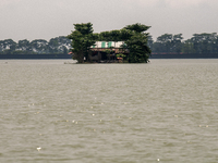 A house is being seen partially submerged after a flood in Gowainghat, Sylhet, Bangladesh, on Friday, June 21, 2024. (