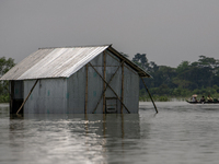 A house is being seen partially submerged after a flood in Gowainghat, Sylhet, Bangladesh, on Friday, June 21, 2024. (